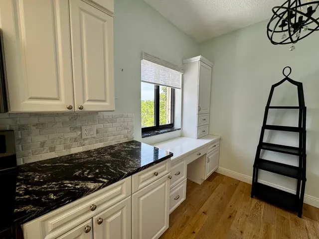 a kitchen with wooden cabinets and a stove