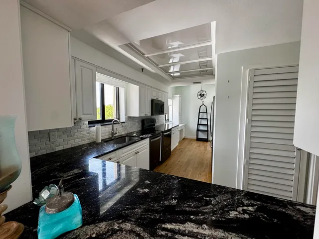a kitchen with granite countertop lots of counter top space