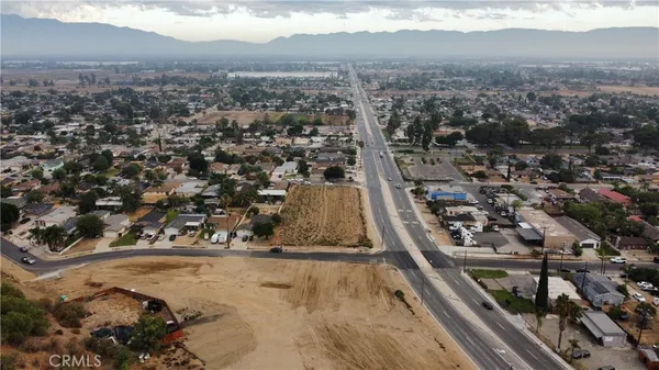 a view of a backyard and a street