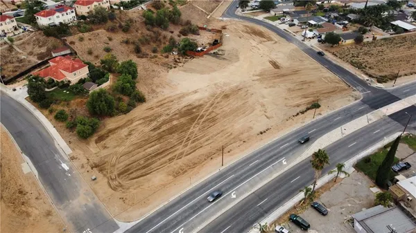 a vase of flowers sitting on a floor