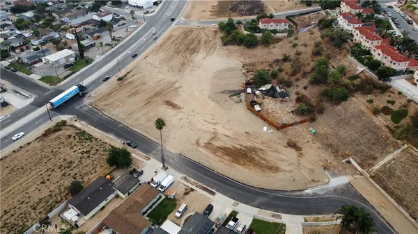 a vase of flowers sitting on a floor
