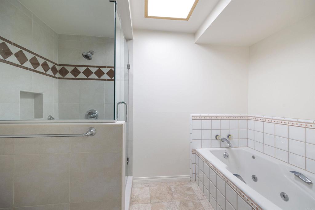 13236 Fiji Way, Unit L Marina del Rey, CA 90292 - Photo 15 of 19 a bathroom with a bathtub and shower