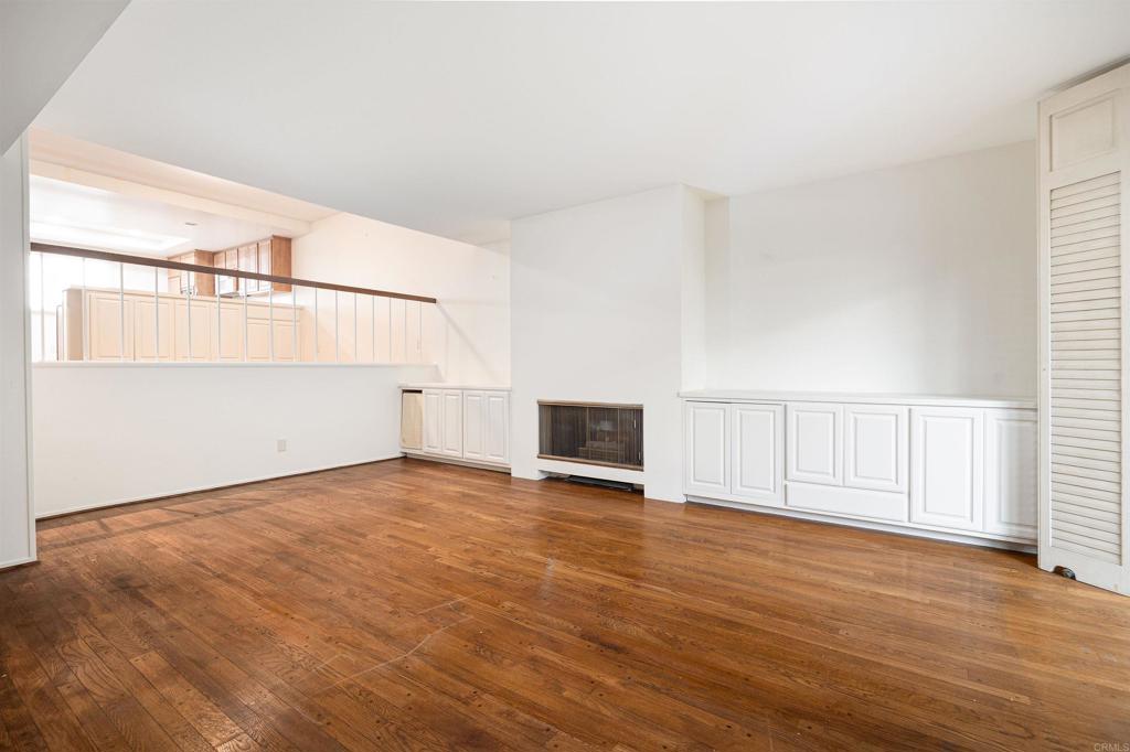 13236 Fiji Way, Unit L Marina del Rey, CA 90292 - Photo 2 of 19 an empty room with wooden floor and windows