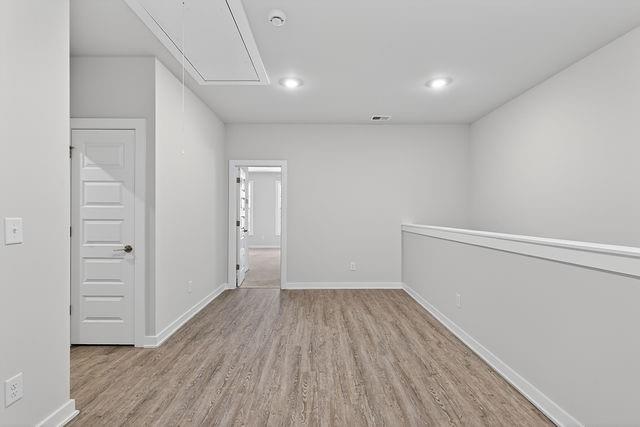 2534 Harbor Rdg Pass, Unit 344 Gainesville, GA 30507 - Photo 16 of 28 wooden floor in an empty room with a window