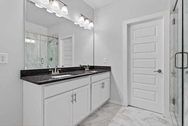 2534 Harbor Rdg Pass, Unit 344 Gainesville, GA 30507 - Photo 18 of 28 a bathroom with a granite countertop sink a large mirror and a