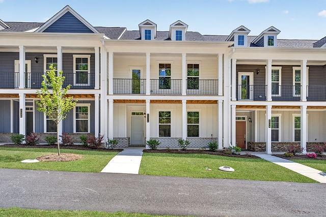 2534 Harbor Rdg Pass, Unit 344 Gainesville, GA 30507 - Photo 2 of 28 front view of a brick house with a yard