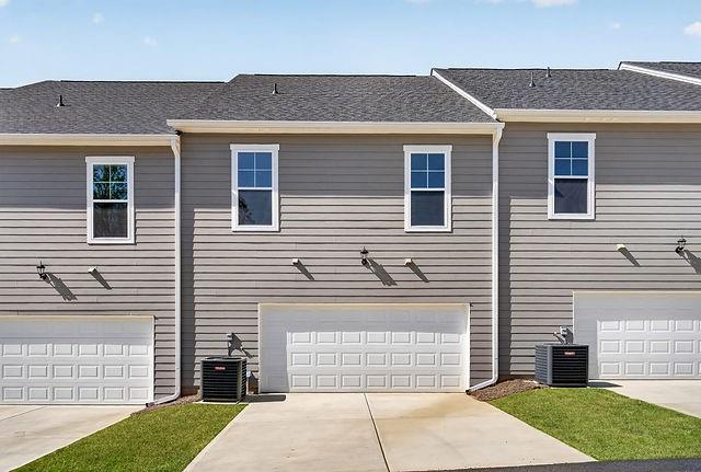 2534 Harbor Rdg Pass, Unit 344 Gainesville, GA 30507 - Photo 28 of 28 a front view of a house with a garden
