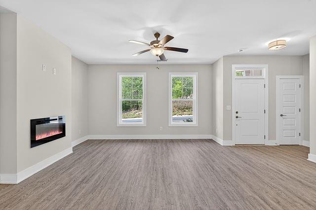 2534 Harbor Rdg Pass, Unit 344 Gainesville, GA 30507 - Photo 6 of 28 wooden floor in an empty room with a window