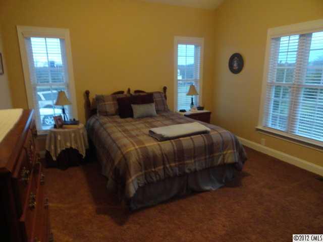 1137 Crossland Road Clover, SC 29710 - Photo 11 of 16 a bedroom with a bed wall painting and window