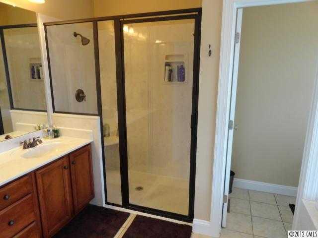 1137 Crossland Road Clover, SC 29710 - Photo 12 of 16 a bathroom with a shower sink and mirror