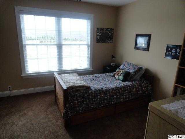 1137 Crossland Road Clover, SC 29710 - Photo 14 of 16 a bedroom with a bed and a window
