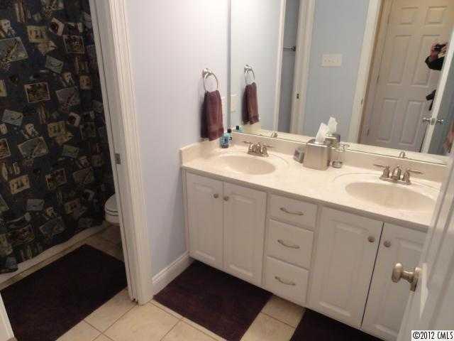 1137 Crossland Road Clover, SC 29710 - Photo 16 of 16 a bathroom with a double vanity sink and mirror