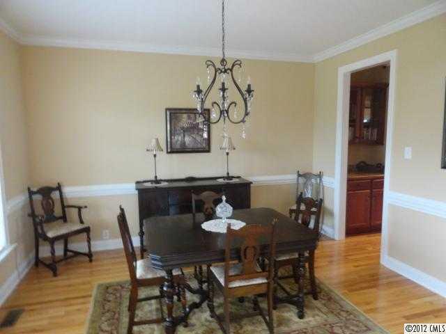 1137 Crossland Road Clover, SC 29710 - Photo 5 of 16 a view of a dining room with furniture and wooden floor
