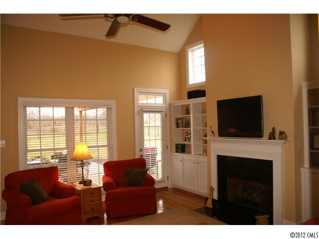 1137 Crossland Road Clover, SC 29710 - Photo 6 of 16 a living room with furniture a flat screen tv and a fireplace