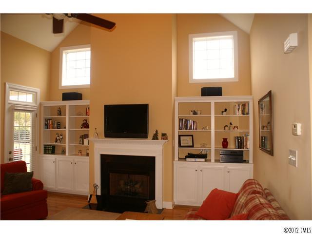 1137 Crossland Road Clover, SC 29710 - Photo 8 of 16 a living room with furniture a flat screen tv and a fireplace