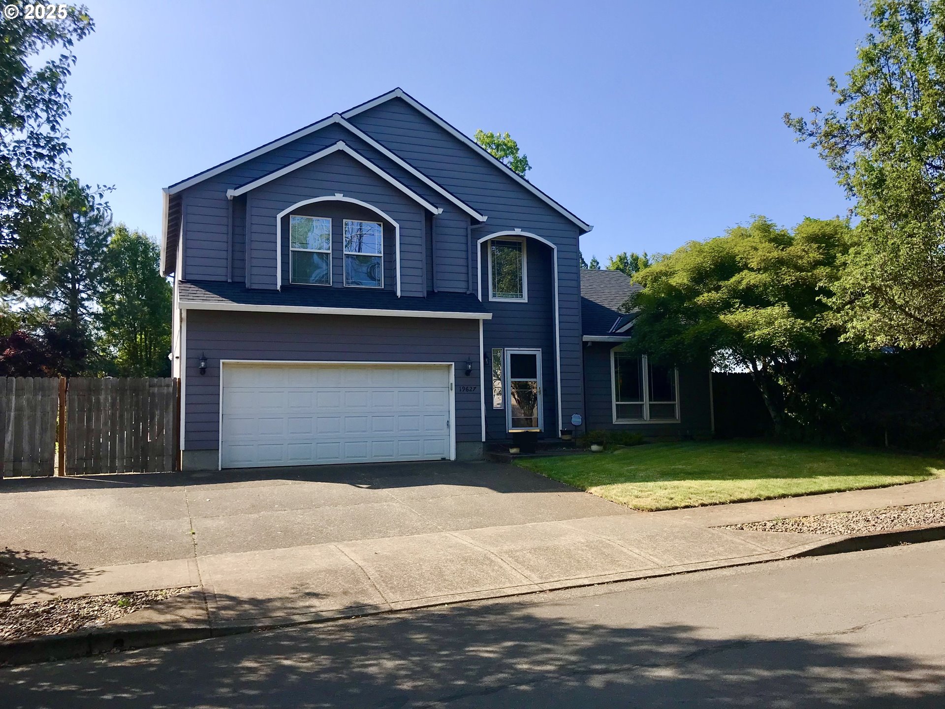 19627 Renee Way Oregon City, OR 97045 - Photo 1 of 1 a front view of a house with a yard and garage