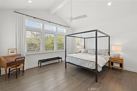 a bedroom with a bed chair and a window