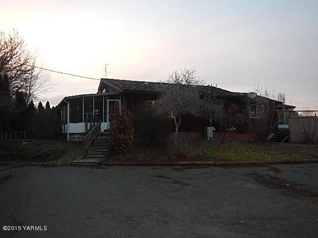10111 Meadowbrook Road Yakima, WA 98903 - Photo 1 of 10 a view of a house with a yard