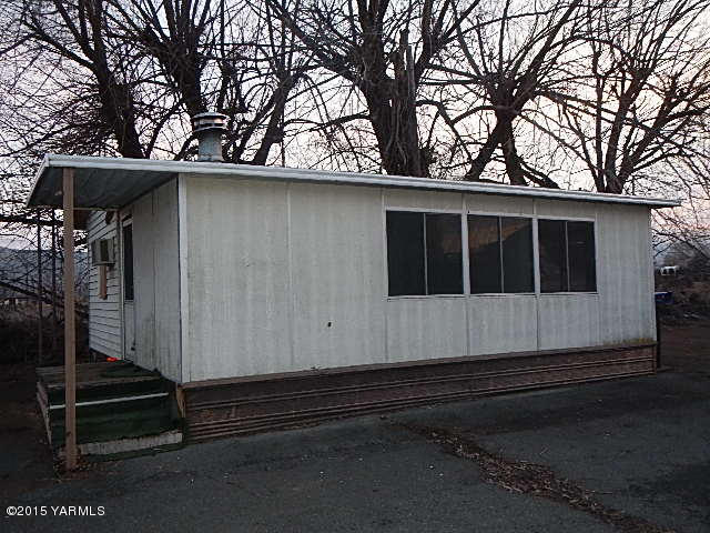 10111 Meadowbrook Road Yakima, WA 98903 - Photo 10 of 10 a house with trees in the background