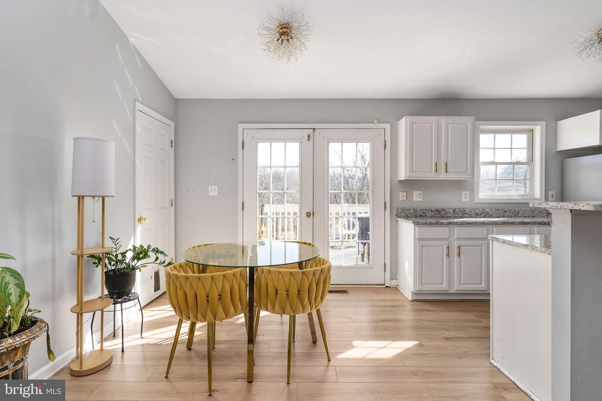 7541 Eggbornsville Road Rixeyville, VA 22737 - Photo 11 of 61 a kitchen with granite countertop white cabinets and counter space