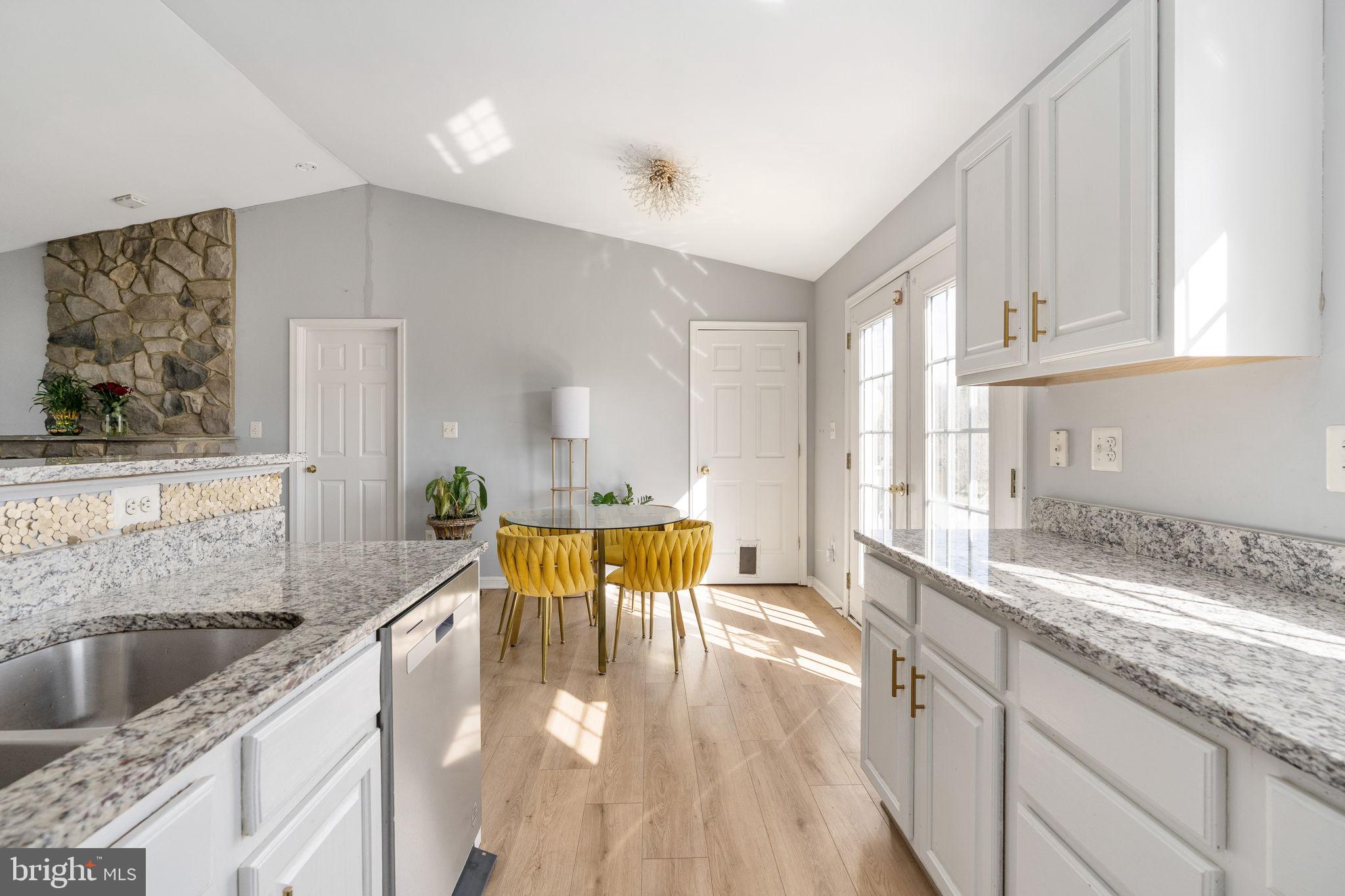 7541 Eggbornsville Road Rixeyville, VA 22737 - Photo 12 of 61 a kitchen with stainless steel appliances granite countertop a sink and a white cabinets