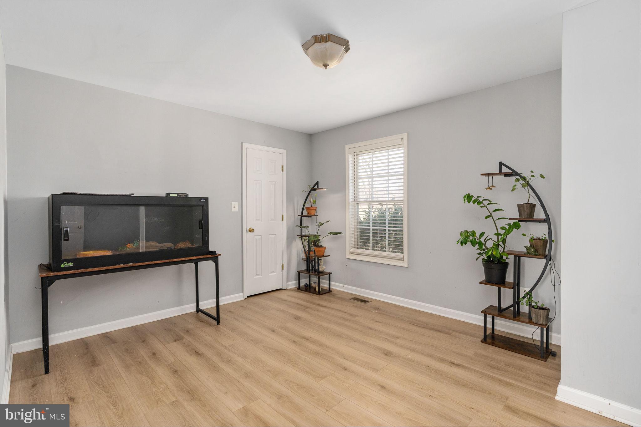 7541 Eggbornsville Road Rixeyville, VA 22737 - Photo 19 of 61 a living room with furniture and a flat screen tv