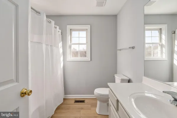 a view of a town with mountains in the background