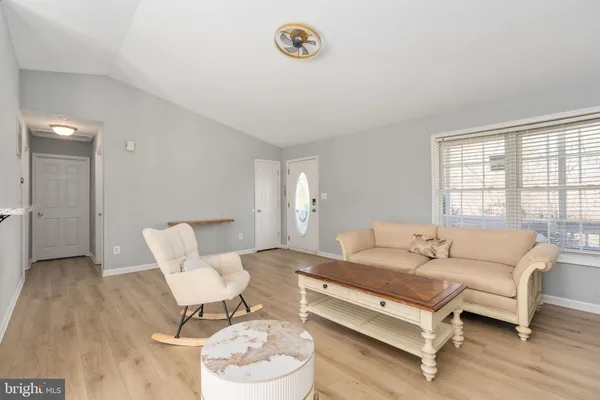 a kitchen with stainless steel appliances granite countertop a sink and a white cabinets