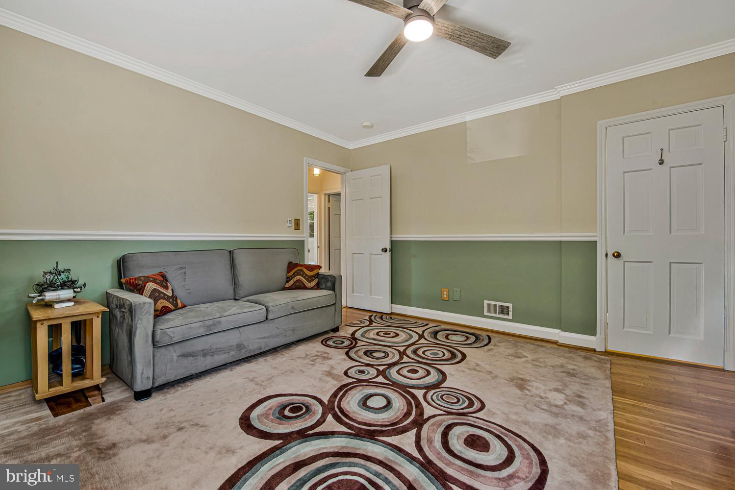 902 Locustvale Road Towson, MD 21204 - Photo 24 of 35 a living room with furniture and a wooden floor