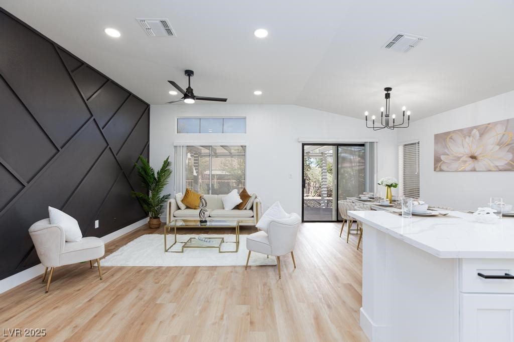 502 Edgefield Ridge Place Henderson, NV 89012 - Photo 1 of 38 Living area featuring a chandelier, light wood-style flooring, vaulted ceiling, ceiling fan, and recessed lighting