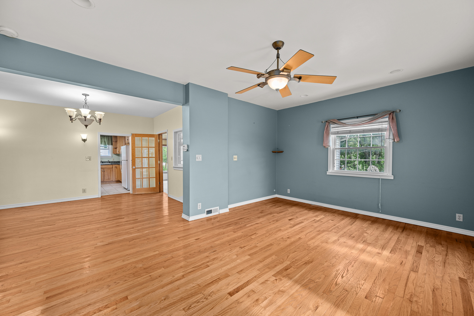 802 North High Street Port Byron, IL 61275 - Photo 14 of 43 wooden floor in an empty room with a window