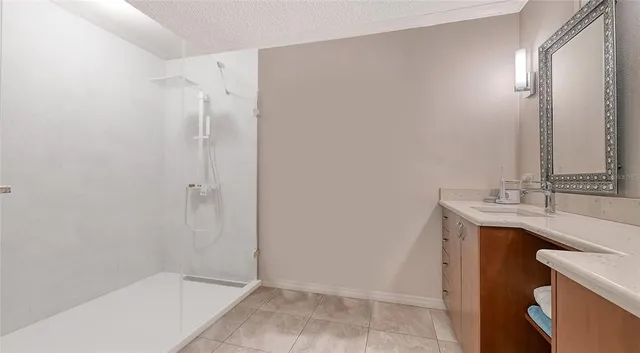 a bathroom with a sink and mirror