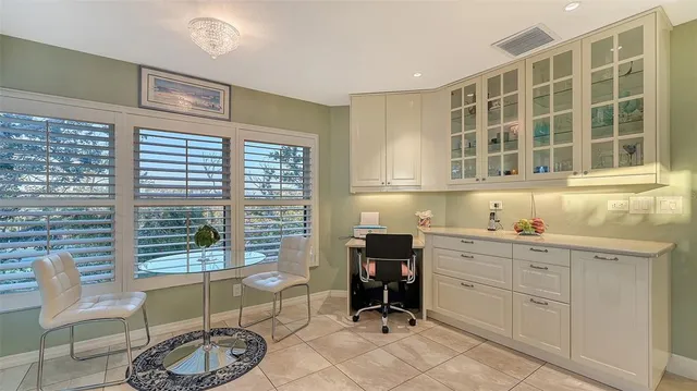 a kitchen with a window and a table in it