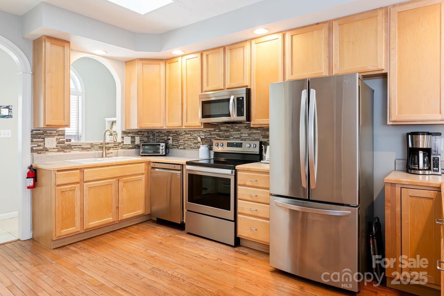 121 Shadowbrook Drive Asheville, NC 28805 - Photo 13 of 32 a kitchen with appliances a sink and a window