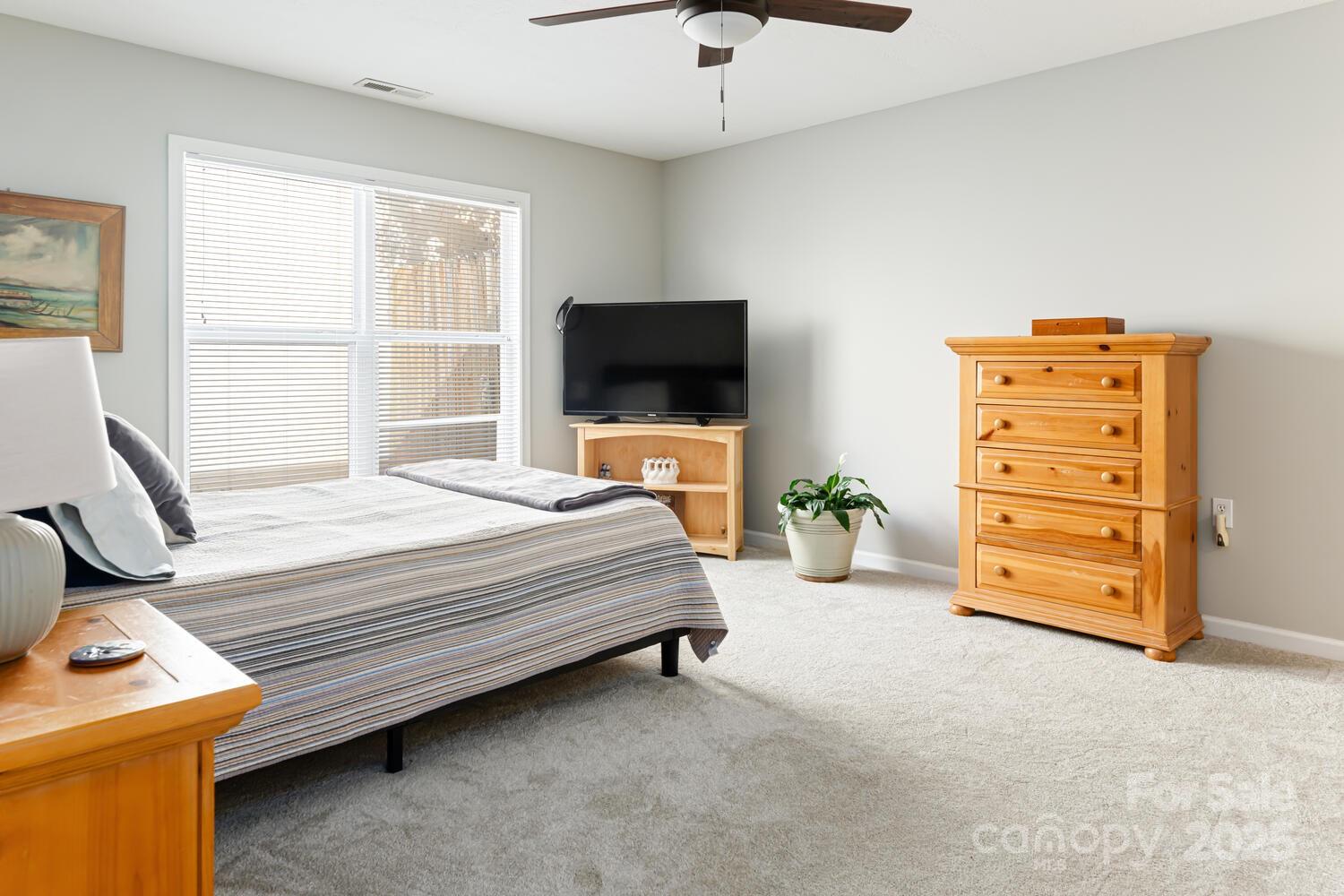 121 Shadowbrook Drive Asheville, NC 28805 - Photo 21 of 32 a bedroom with a bed and furniture