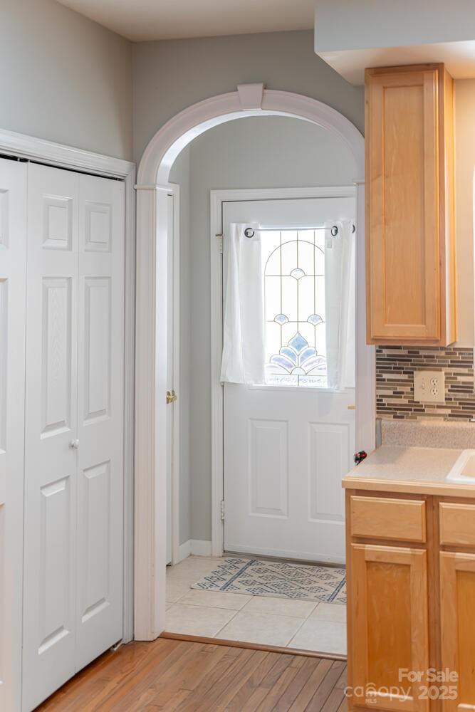 121 Shadowbrook Drive Asheville, NC 28805 - Photo 7 of 32 a view of empty room with window and wooden floor