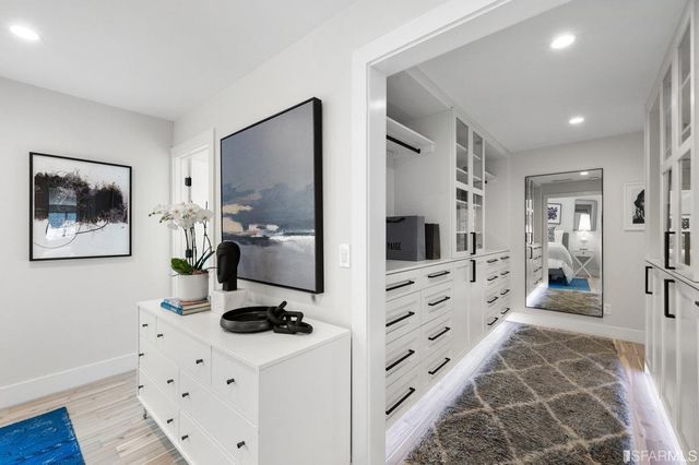 a en suite bathroom with a toilet sink and mirror