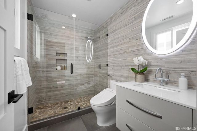 a bedroom with a large bed and a window