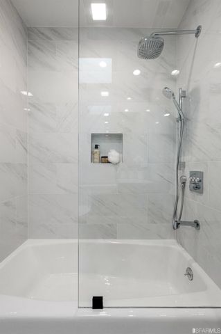 a bedroom with bed and a window