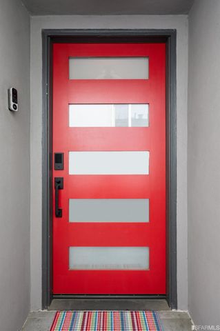 a backyard of a house with plants and outdoor seating