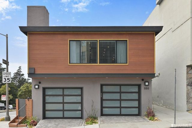 a view of a livingroom with closet and a potted plant