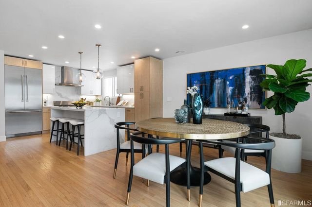 a kitchen with a table and chairs in it