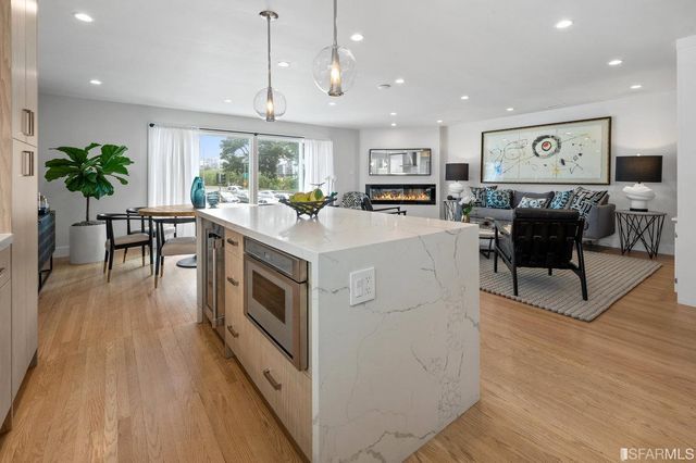 a view of kitchen with cabinets and wooden floor