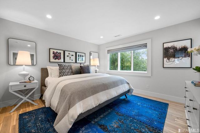 a bedroom with bed and window