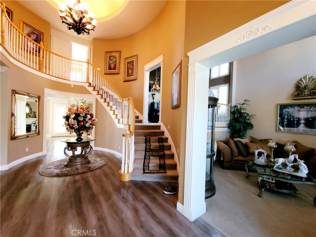 14119 Ashton Lane Riverside, CA 92508 - Photo 21 of 47 a living room with furniture and a chandelier