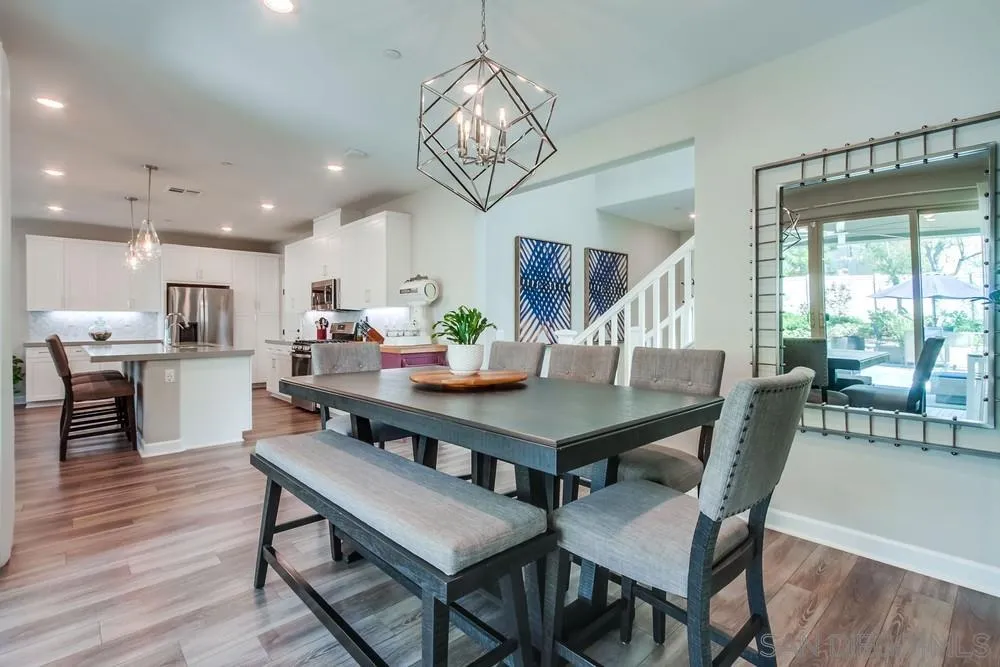 1933 Pascal Court Escondido, CA 92026 - Photo 15 of 52 a view of a dining room with furniture window and wooden floor