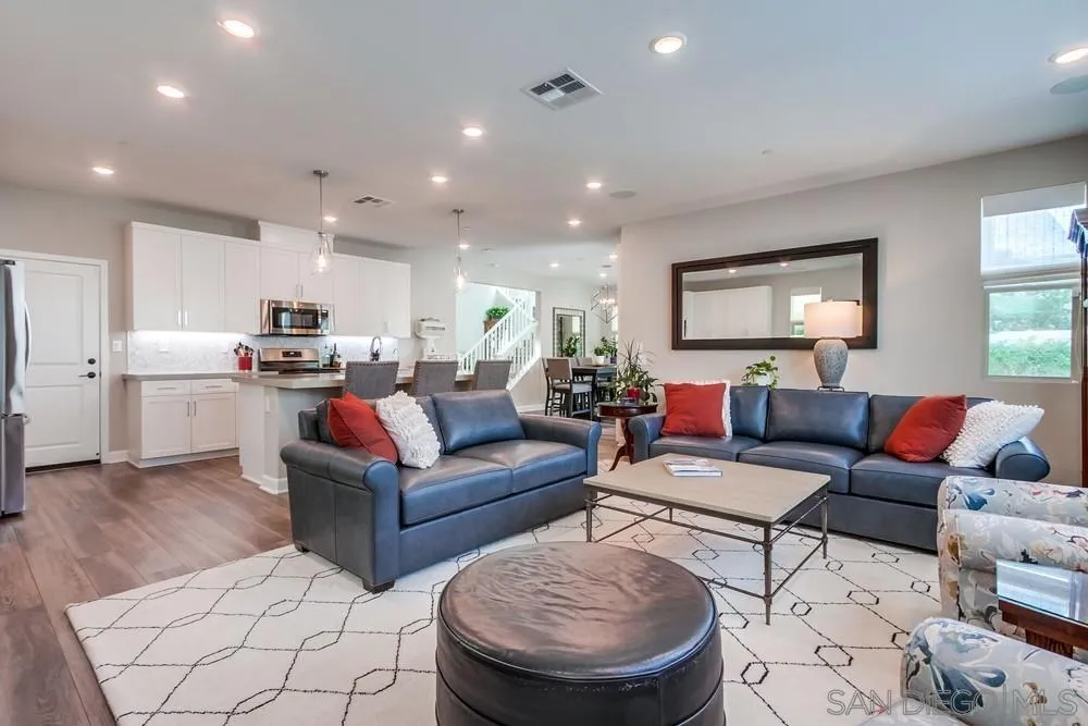 1933 Pascal Court Escondido, CA 92026 - Photo 19 of 52 a living room with furniture and a view of kitchen