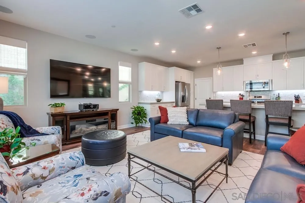 1933 Pascal Court Escondido, CA 92026 - Photo 20 of 52 a living room with furniture and a flat screen tv