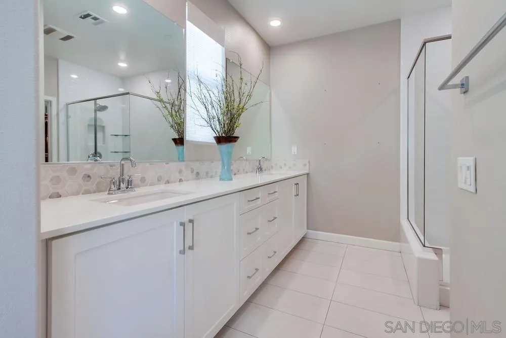 1933 Pascal Court Escondido, CA 92026 - Photo 26 of 52 a bathroom with a double vanity sink and mirror