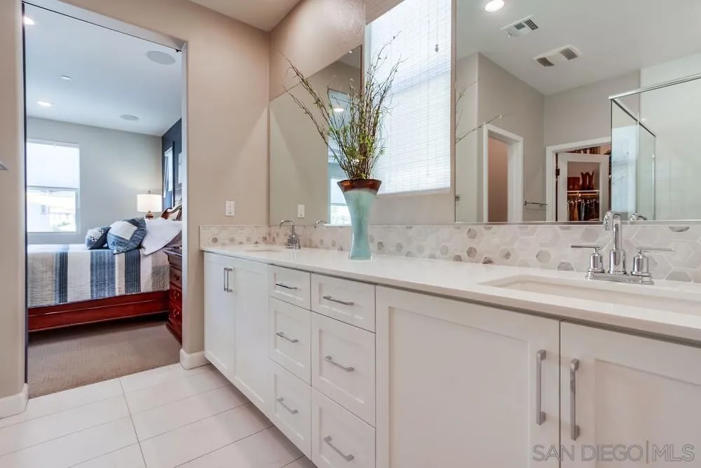 1933 Pascal Court Escondido, CA 92026 - Photo 27 of 52 a en suite bathroom with double sink and a mirror